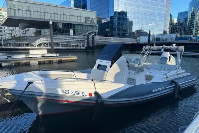 The Image of 2022 Zar 79SL boat docked in urban marina with modern buildings in background. - 0