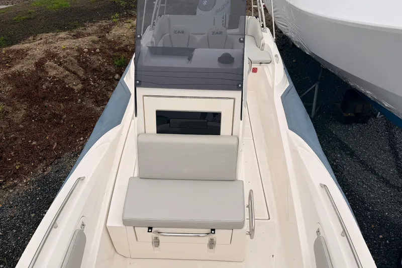 Slide: The Image of 2022 Zar 79SL boat with sleek design, featuring cushioned seating and modern console. - 10