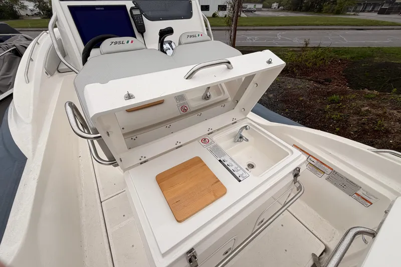 Slide: The Image of Zar 79SL 2022 boat kitchenette with sink and cutting board. - 11