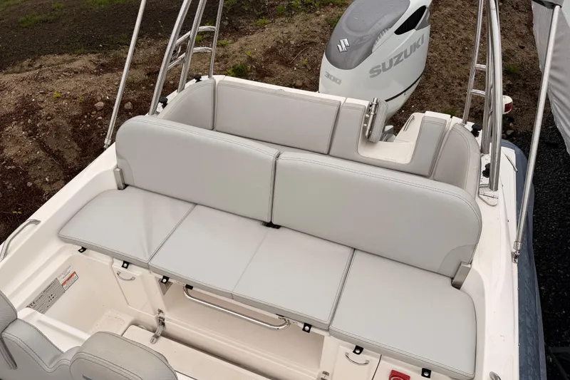 Slide: The Image of Zar 79SL 2022 boat with Suzuki engine and seating area. - 19