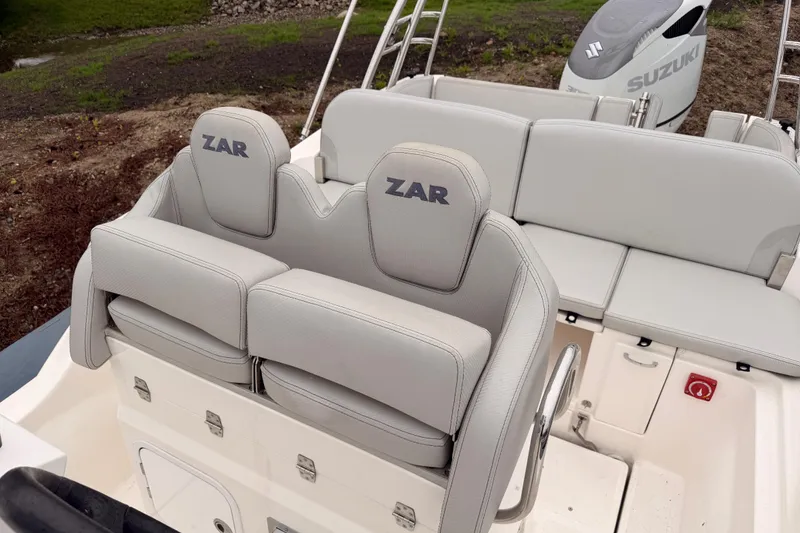 Slide: The Image of 2022 Zar 79SL boat interior with Suzuki engine, featuring comfortable seating and modern design. - 24