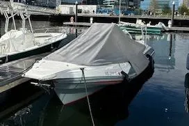Slide: The Image of Covered 2022 Zar 79SL boat docked in a marina. - 5