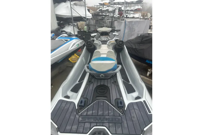 Slide: The Image of 2021 Sea-Doo GTX Limited 300 jet ski in storage, showcasing sleek design and seating. - 5