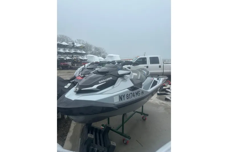 Slide: The Image of 2021 Sea-Doo GTX Limited 300 jet ski parked outdoors on a cloudy day. - 6