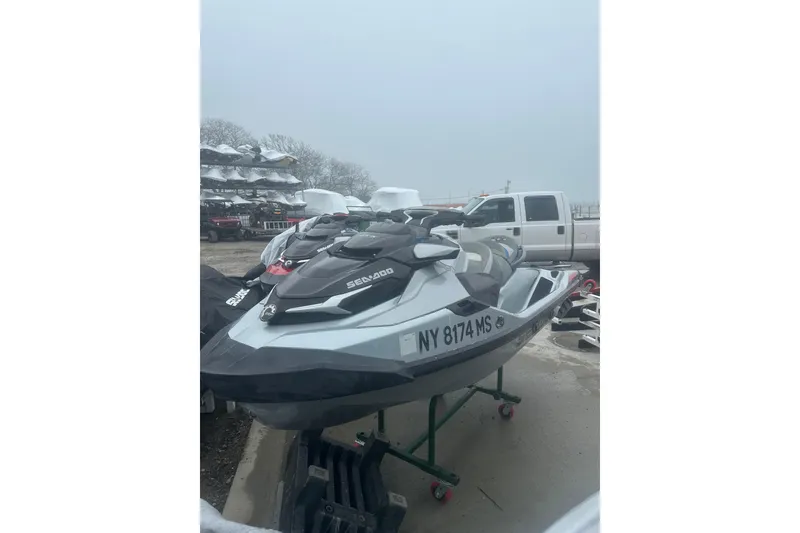 Slide: The Image of 2021 Sea-Doo GTX Limited 300 jet ski parked outdoors on a cloudy day. - 7