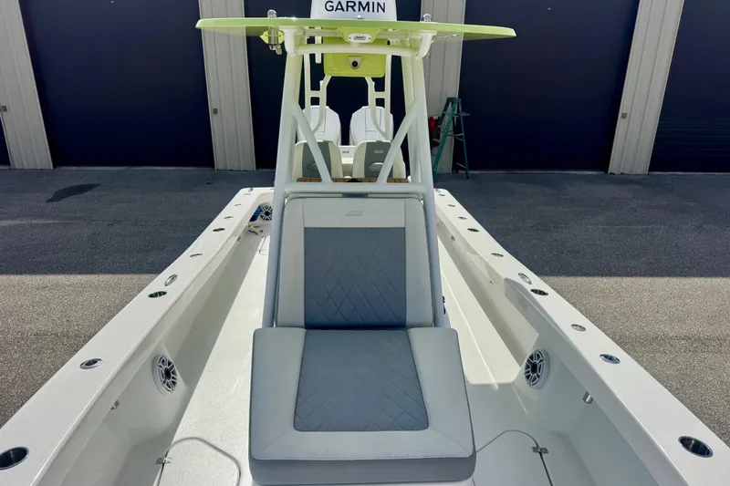 Slide: The Image of 2023 ZCB Freemason 26 boat with Garmin equipment, docked in a marina. - 6