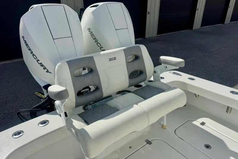 Slide: The Image of 2023 ZCB Freemason 26 boat with dual Mercury engines and cushioned seating. - 9