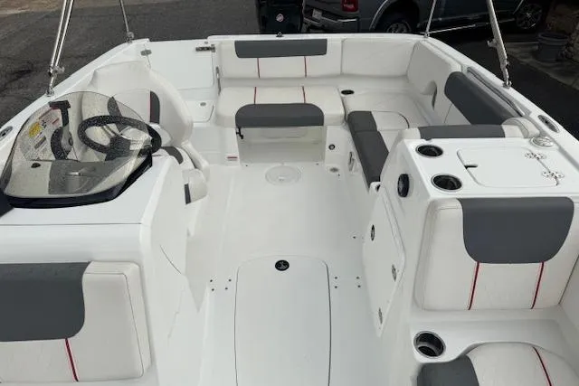 Slide: The Image of Interior of a 2018 Tahoe 1950 boat with white and gray seating. - 9