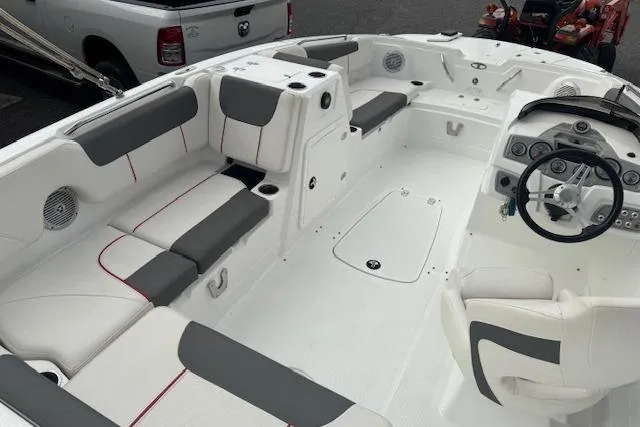 Slide: The Image of Interior of a 2018 Tahoe 1950 boat with white and gray seating. - 11