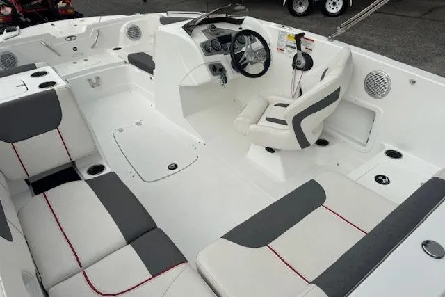 Slide: The Image of Interior of a 2018 Tahoe 1950 boat with modern seating and steering console. - 12