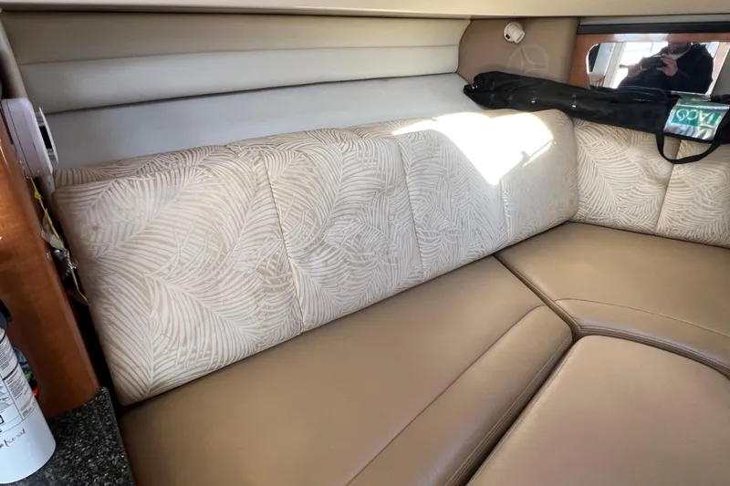 Slide: The Image of 2007 Robalo R305 Walkaround cabin interior with patterned upholstery and beige seating. - 23