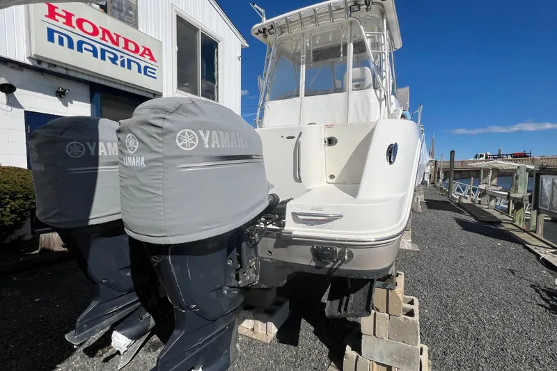 Slide: The Image of 2007 Robalo R305 Walkaround boat with Yamaha engines at Honda Marine dealership. - 3