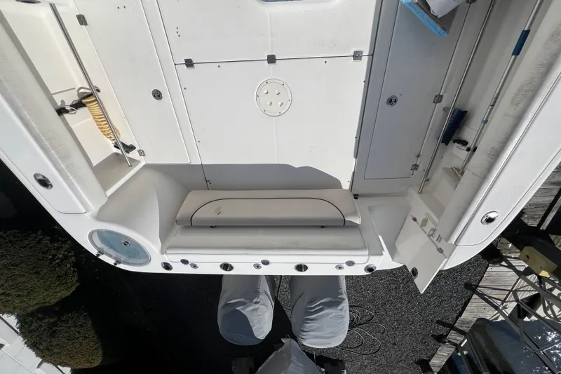 Slide: The Image of 2007 Robalo R305 Walkaround boat deck with seating and storage compartments. - 6