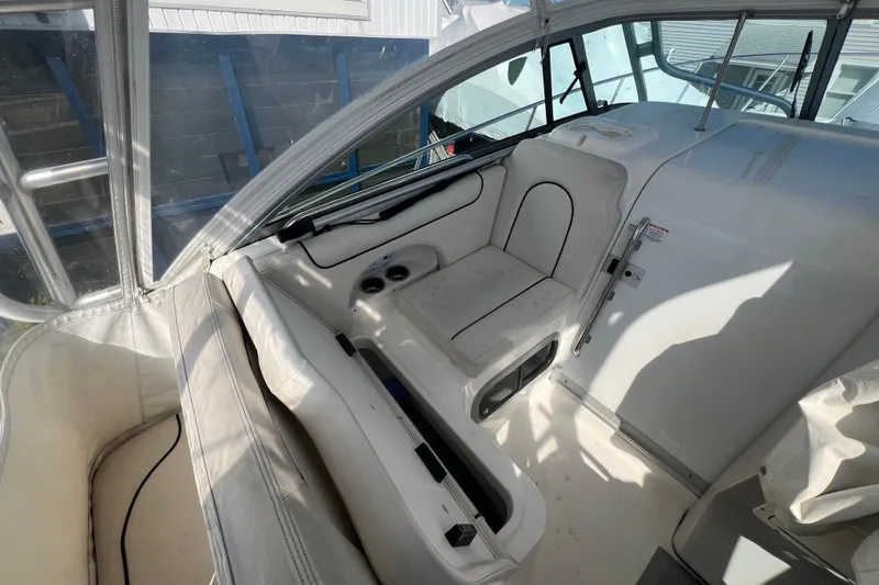 Slide: The Image of 2007 Robalo R305 Walkaround boat interior with seating and storage compartments. - 7