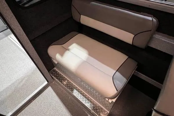 Slide: The Image of 2025 KingFisher 2225 Escape HT interior seating with modern upholstery and diamond plate flooring. - 10