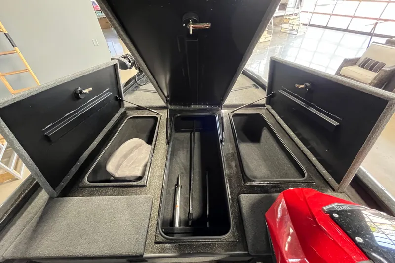 Slide: The Image of Open storage compartments of 2024 Avid 19 XB boat, showcasing interior layout. - 5
