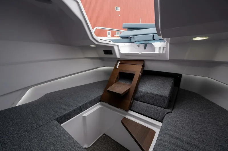 Slide: The Image of Interior of 2026 Axopar 29 XC Cross Cabin with modern seating and sleek design. - 31