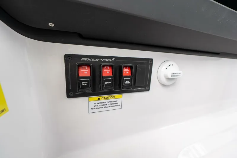 Slide: The Image of Control panel of 2026 Axopar 29 XC Cross Cabin with switches and diagnostics. - 34