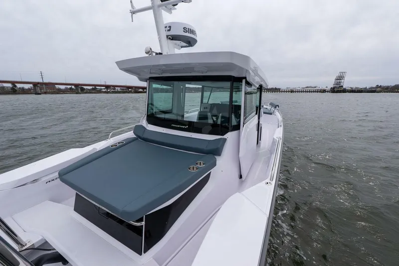 Slide: The Image of 2026 Axopar 29 XC Cross Cabin boat on water, showcasing sleek design and modern features. - 4