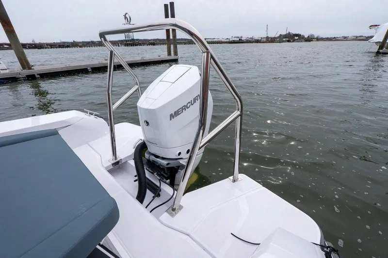 Slide: The Image of 2026 Axopar 29 XC Cross Cabin with Mercury outboard engine on water. - 6