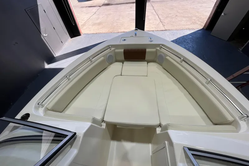 Slide: The Image of 2023 Cobia 220 Dual Console boat interior with spacious seating and sleek design. - 13