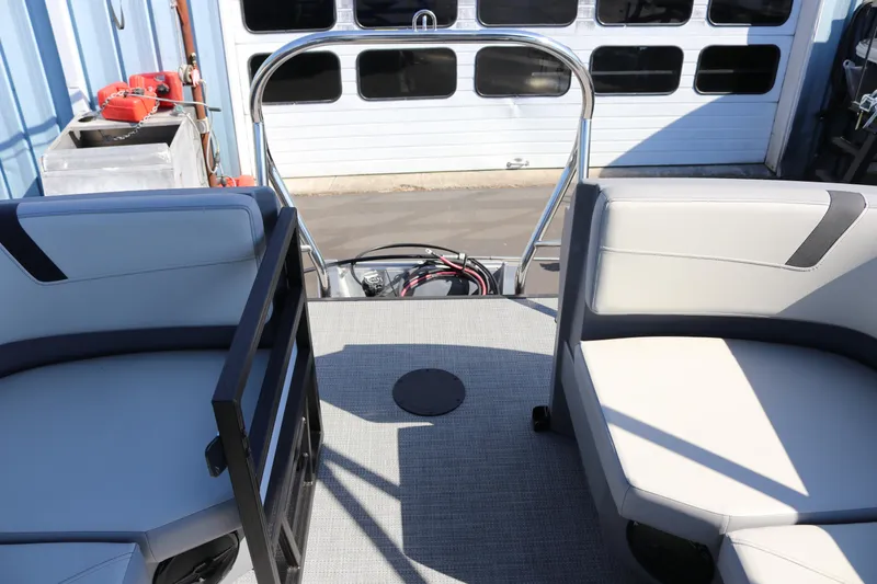 Slide: The Image of 2025 SunChaser Lucerne 20 LR DH boat interior with seating and railing. - 12