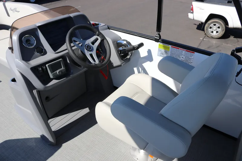 Slide: The Image of Captain's helm of 2025 SunChaser Lucerne 20 LR DH pontoon boat, featuring modern controls and seating. - 13