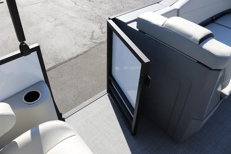 Slide: The Image of 2025 SunChaser Lucerne 20 LR DH boat interior with open door and seating area. - 18