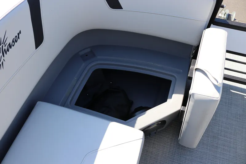 Slide: The Image of Storage compartment in 2025 SunChaser Lucerne 20 LR DH boat with cushioned seating. - 22