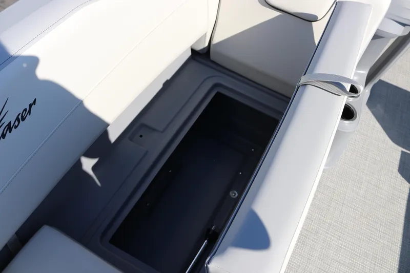 Slide: The Image of 2025 SunChaser Lucerne 20 LR DH boat seat storage compartment, open and empty. - 23