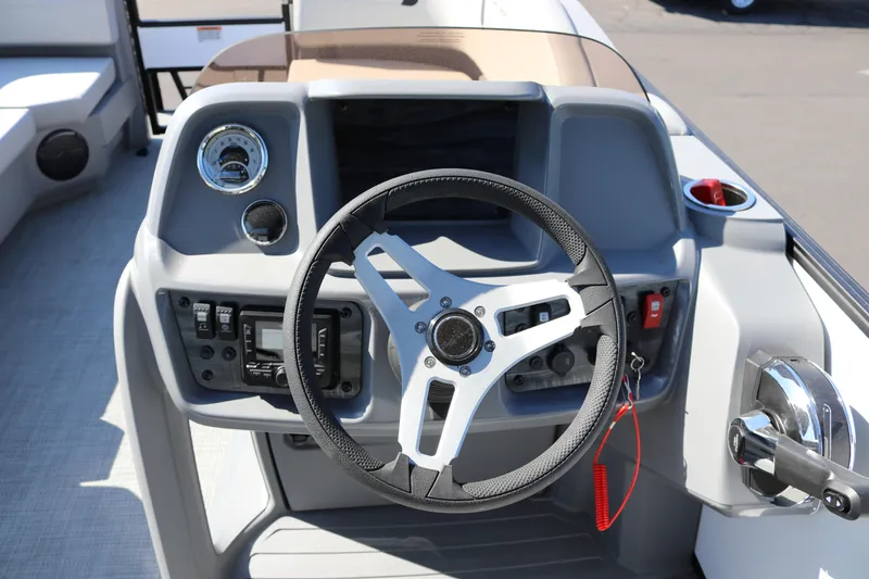 Slide: The Image of Steering console of 2025 SunChaser Lucerne 20 LR DH boat with modern controls. - 25
