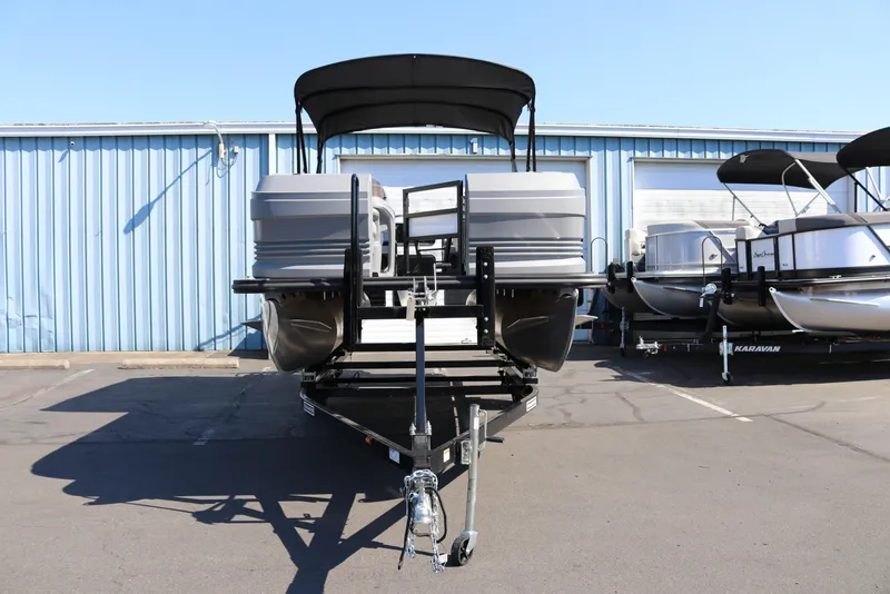 Slide: The Image of 2025 SunChaser Lucerne 20 LR DH pontoon boat on trailer, parked outdoors. - 3