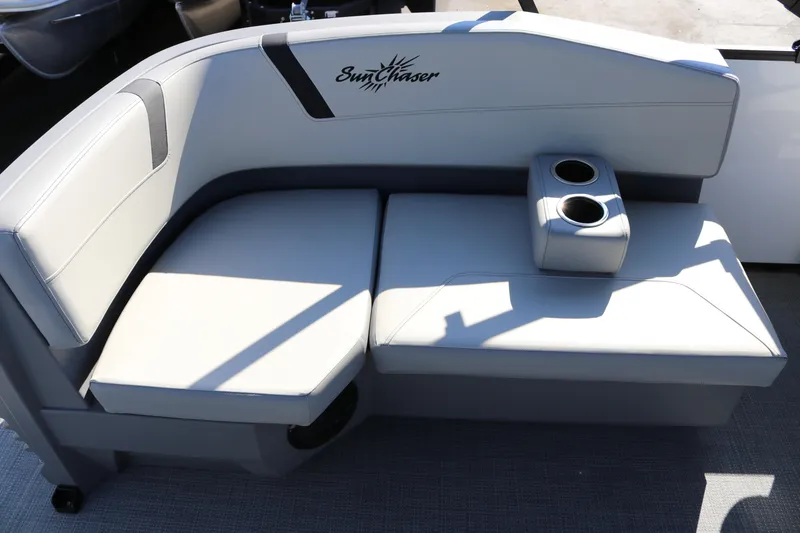 Slide: The Image of SunChaser Lucerne 20 LR DH 2025 boat seating with cup holders, featuring sleek design. - 30