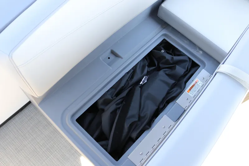 Slide: The Image of Storage compartment in 2025 SunChaser Lucerne 20 LR DH boat with cushioned seating. - 32