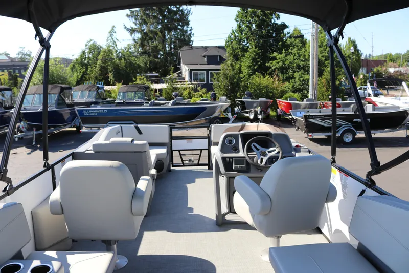 Slide: The Image of 2025 SunChaser Lucerne 20 LR DH pontoon boat interior with helm and seating. - 34