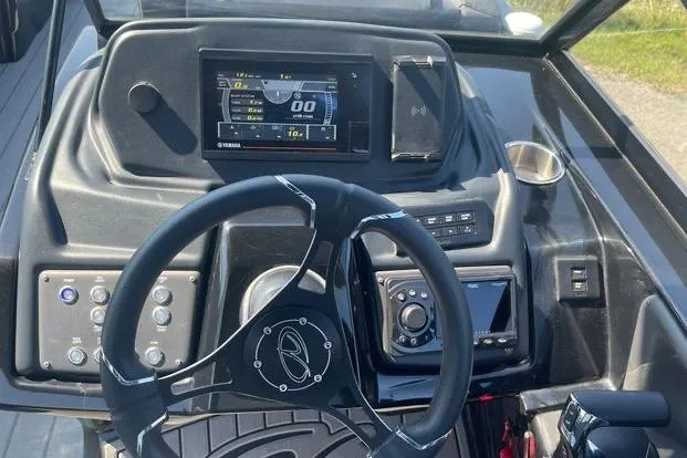 Slide: The Image of Steering console of 2023 Veranda V One 25 boat with digital display and controls. - 3