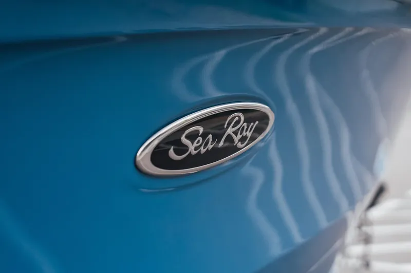 Slide: The Image of 2024 Sea Ray SPX 210 Outboard logo on sleek blue hull. - 5