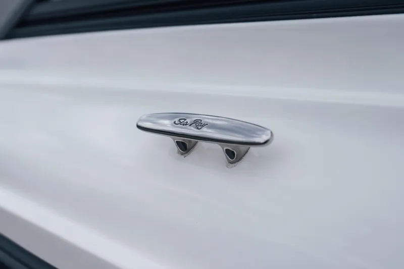 Slide: The Image of 2024 Sea Ray SPX 210 Outboard boat cleat detail in polished metal. - 7