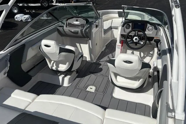 Slide: The Image of 2023 Chaparral 21 SSi boat interior with modern seating and dashboard design. - 33