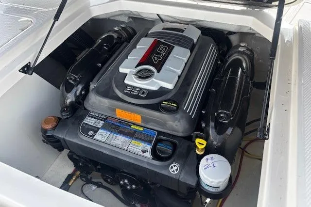 Slide: The Image of 2023 Chaparral 21 SSi boat engine compartment with 4.5L 250 horsepower engine. - 34