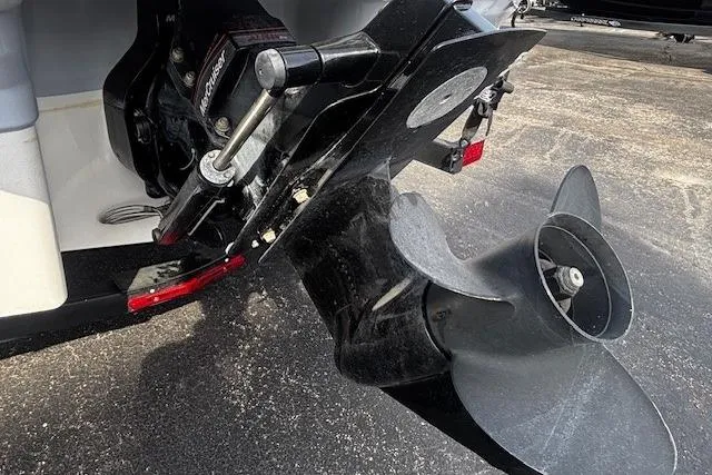 Slide: The Image of 2023 Chaparral 21 SSi boat propeller and outdrive on pavement. - 38