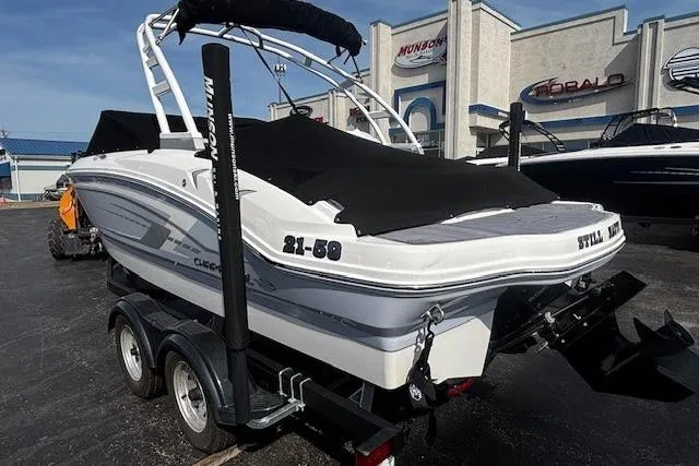 Slide: The Image of 2023 Chaparral 21 SSi boat on trailer, covered, parked at dealership. - 39