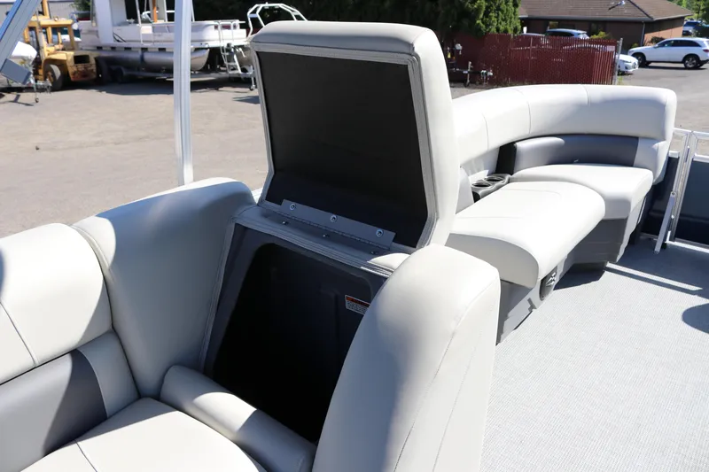 Slide: The Image of 2025 SunChaser Vista 18 LR pontoon boat interior with open storage compartment. - 13