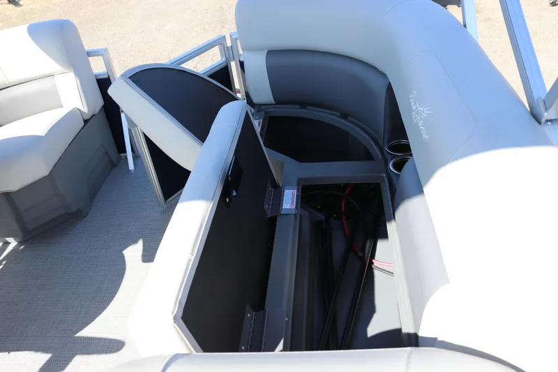 Slide: The Image of 2025 SunChaser Vista 18 LR pontoon boat interior with open storage compartments. - 14