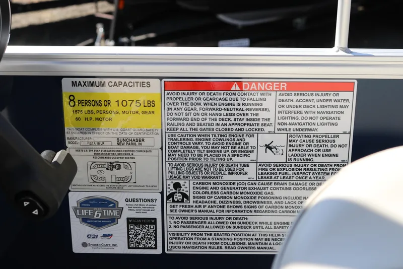 Slide: The Image of Safety and capacity labels on 2025 SunChaser Vista 18 LR boat, highlighting maximum load and warnings. - 18