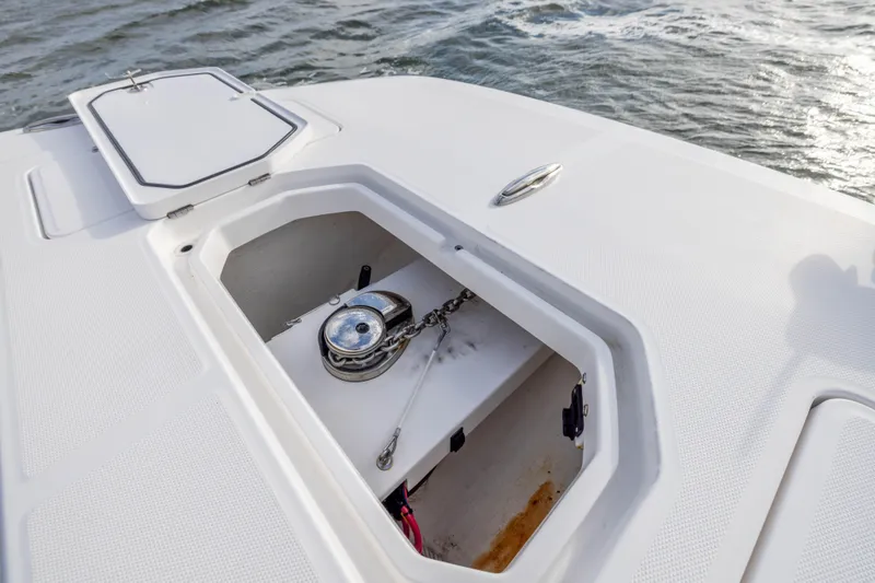 Slide: The Image of Anchor compartment of 2024 Invincible 35 Catamaran on open water. - 11