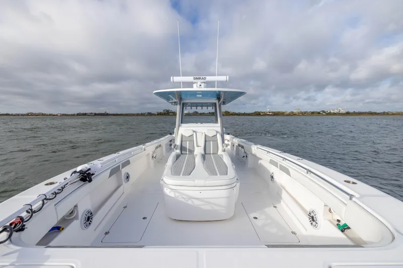 Slide: The Image of 2024 Invincible 35 Catamaran on open water, showcasing spacious deck and seating. - 14