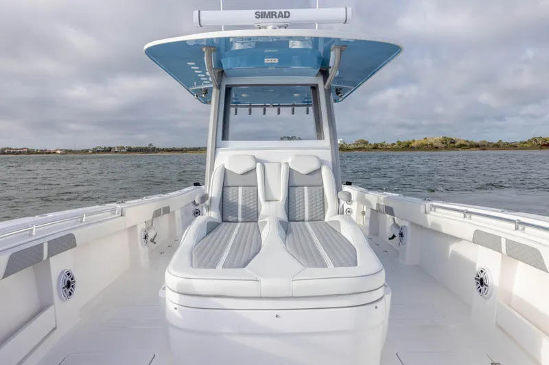 Slide: The Image of 2024 Invincible 35 Catamaran with sleek seating and modern design on open water. - 15