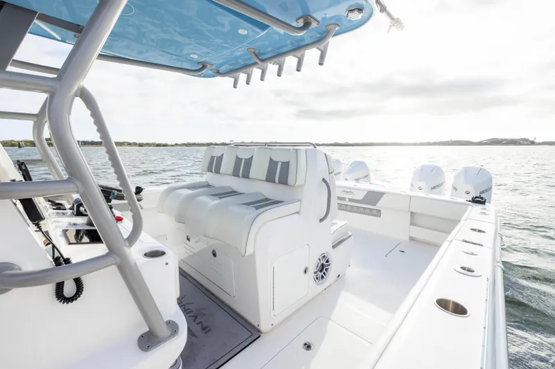 Slide: The Image of 2024 Invincible 35 Catamaran with sleek seating and powerful outboard engines on open water. - 24