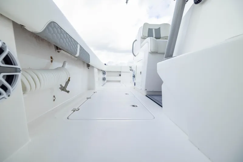 Slide: The Image of 2024 Invincible 35 Catamaran interior, showcasing sleek white deck and seating. - 27